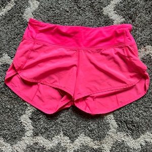 Bright pink 2.5” speed up lululemon shorts. Size 4
